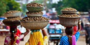 Women carrying loads of soil